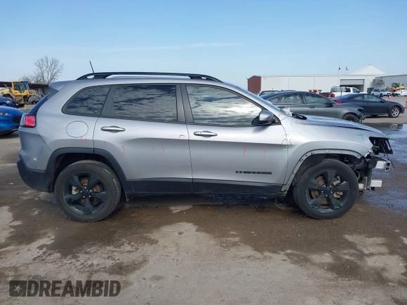 2021 Jeep Cherokee Altitude with VIN 1C4PJLLB6MD112830, listed as a IAAI auction lot 41560135 with 76,760 mi miles. Bid and sale history available at carsss.com. Image 14.