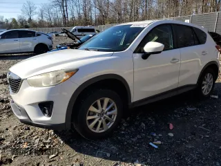 2014 Mazda CX-5 Touring z VIN JM3KE4CY2E0426869, wystawiony jako Copart lot #86958274 z przebiegiem 114 482 mil mil oraz Szkody całkowita. Historia ofert i sprzedaży dostępna na DreamBid. Obrazek 1.