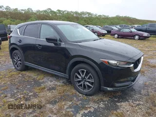 2018 Mazda CX-5 Touring with VIN JM3KFACM0J0315739, listed as a IAAI auction lot 40516262 with 60,727 mi miles. Bid and sale history available at carsss.com. Image 1.