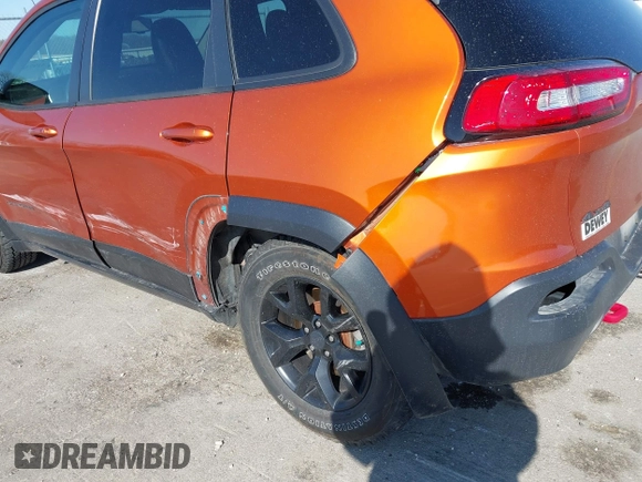 2016 Jeep Cherokee Trailhawk with VIN 1C4PJMBBXGW251682, listed as a IAAI auction lot 41973696 with 100,411 mi miles. Bid and sale history available at carsss.com. Image 6.