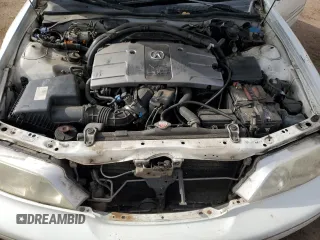 1998 Acura RL Premium z VIN JH4KA9657WC008762, wystawiony jako Copart lot #52979915 z przebiegiem 144 954 mil mil oraz Szkody całkowita. Historia ofert i sprzedaży dostępna na DreamBid. Obrazek 12.