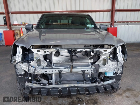 2025 Toyota Tacoma SR with VIN 3TMLB5JN7SM100983, listed as a IAAI auction lot 42220559 with 2,119 mi miles and . Bid and sale history available at DreamBid. Image 6.