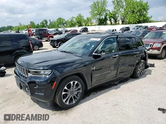 2023 Jeep Grand Cherokee Overland with VIN 1C4RJHDG0PC670537, listed as a Copart auction lot 56757285 with 24,735 mi miles and Salvage title. Bid and sale history available at DreamBid. Image 13.