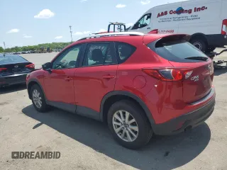 2016 Mazda CX-5 Sport with VIN JM3KE4BY3G0765905, listed as a Copart auction lot 61874165 with 134,546 mi miles and Salvage title. Bid and sale history available at DreamBid. Image 2.