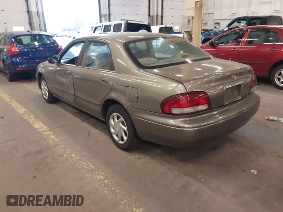 1999 Mazda 626 ES with VIN 1YVGF22C1X5852798, listed as a IAAI auction lot 41736489 with 136,536 mi miles. Bid and sale history available at carsss.com. Image 3.