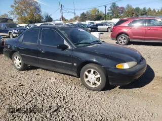 1996 Ford Contour z VIN 1FALP65L5TK212857, wystawiony jako Copart lot #76701614 z przebiegiem 74 994 mil mil oraz Szkody całkowita. Historia ofert i sprzedaży dostępna na DreamBid. Obrazek 4.