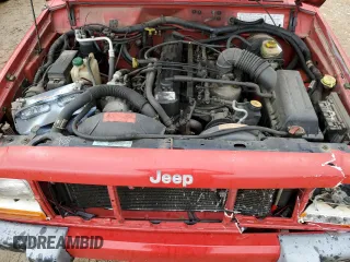 1999 Jeep Cherokee Sport with VIN 1J4FT68S2XL580915, listed as a Copart auction lot 50374875 with 286,276 mi miles and Salvage Title. Bid and sale history available at carsss.com. Image 11.