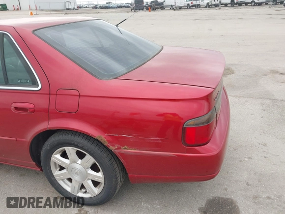 2001 Cadillac Seville z VIN 1G8KS54Y91U227846, wystawiony jako IAAI lot #42134095 z przebiegiem 216 766 mil mil oraz . Historia ofert i sprzedaży dostępna na DreamBid. Obrazek 17.
