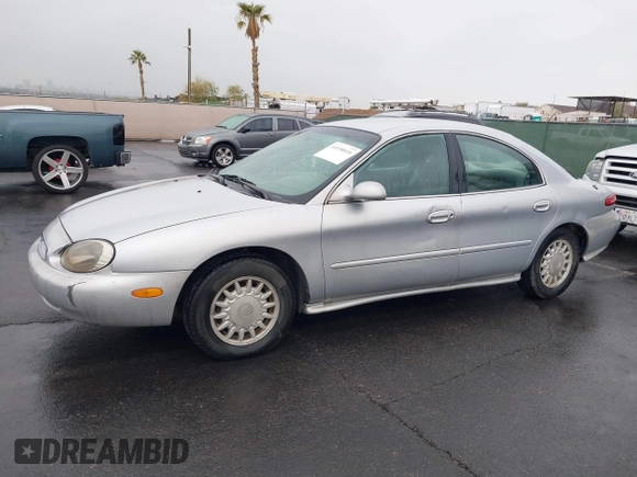 1997 Mercury Sable GS z VIN 1MELM50U8VG603194, wystawiony jako IAAI lot #41558010 z przebiegiem 265 169 mil mil oraz . Historia ofert i sprzedaży dostępna na DreamBid. Obrazek 12.