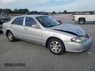 2000 Mazda 626 LX with VIN 1YVGF22C3Y5126135, listed as a Copart auction lot 70650264 with 154,517 mi miles and Salvage Title. Bid and sale history available at carsss.com. Image 4.