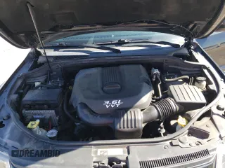 2014 Jeep Grand Cherokee Laredo with VIN 1C4RJEAGXEC217249, listed as a Copart auction lot 48585195 with 131,635 mi miles and Salvage Title. Bid and sale history available at DreamBid. Image 12.