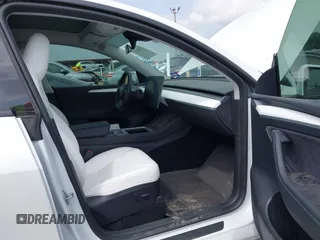 2023 Tesla Model Y Long Range with VIN 7SAYGAEEXPF776370, listed as a IAAI auction lot 42127512 with 27,120 mi miles and . Bid and sale history available at DreamBid. Image 5.