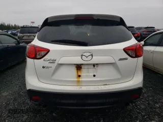 2014 Mazda CX-5 Touring z VIN JM3KE4CY1E0406726, wystawiony jako Copart lot #54652065 z przebiegiem 245 491 mil mil oraz Szkoda całkowita • Salvage title. Historia ofert i sprzedaży dostępna na DreamBid. Obrazek 6.