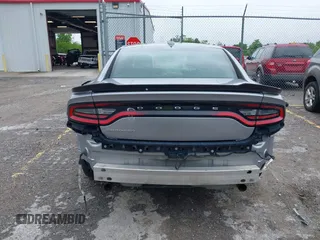 2015 Dodge Charger SXT with VIN 2C3CDXHG1FH886088, listed as a IAAI auction lot 42331369 with 119,659 mi miles and . Bid and sale history available at DreamBid. Image 16.