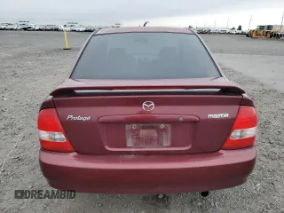 2002 Mazda Protege DX z VIN JM1BJ225320636991, wystawiony jako Copart lot #57915265 z przebiegiem 123 371 mil mil oraz Szkoda całkowita • Salvage title. Historia ofert i sprzedaży dostępna na DreamBid. Obrazek 6.