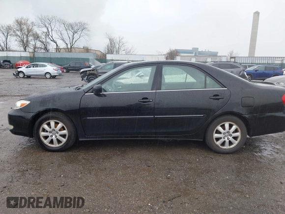 2003 Toyota Camry LE with VIN 4T1BE30K13U144114, listed as a IAAI auction lot 41829879 with 60,385 mi miles and . Bid and sale history available at DreamBid. Image 14.