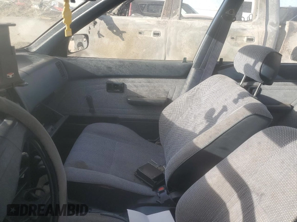 1988 Toyota Corolla with VIN JT2AE92E9J3140852, listed as a Copart auction lot 74968874 with 169,427 mi miles and Salvage title. Bid and sale history available at DreamBid. Image 7.