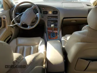 1994 Infiniti Q45 z VIN JNKNG01D3RM252218, wystawiony jako Copart lot #77230944 z przebiegiem 69 069 mil mil oraz Tytuł czysty. Historia ofert i sprzedaży dostępna na DreamBid. Obrazek 8.