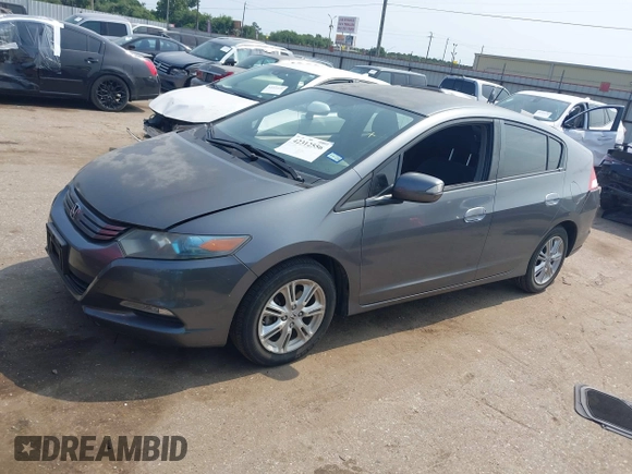 2010 Honda Insight EX with VIN JHMZE2H71AS043465, listed as a IAAI auction lot 42312556 with 151,009 mi miles and . Bid and sale history available at DreamBid. Image 17.
