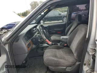 1997 Jeep Grand Cherokee Laredo with VIN 1J4GZ58S0VC771727, listed as a Copart auction lot 82233224 with 320,213 mi miles and Salvage Title. Bid and sale history available at carsss.com. Image 7.