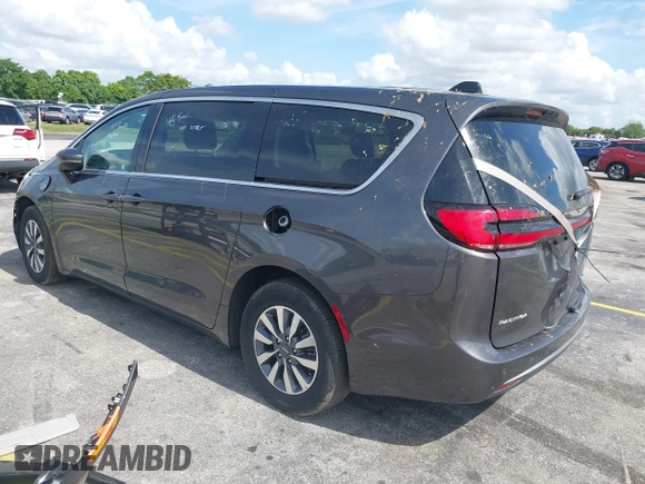 2023 Chrysler Pacifica Hybrid Touring L with VIN 2C4RC1L74PR579782, listed as a IAAI auction lot 42487390 with Not provided miles and . Bid and sale history available at DreamBid. Image 3.