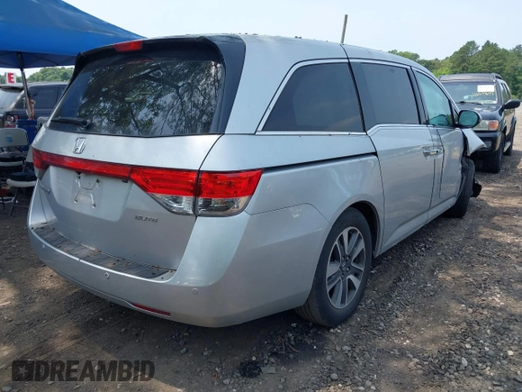 2014 Honda Odyssey Touring with VIN 5FNRL5H97EB054158, listed as a IAAI auction lot 42548360 with 91,161 mi miles and . Bid and sale history available at DreamBid. Image 4.