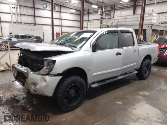 2004 Nissan Titan LE with VIN 1N6AA07B44N512889, listed as a IAAI auction lot 41569019 with 154,655 mi miles. Bid and sale history available at carsss.com. Image 2.