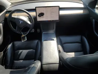 2022 Tesla Model Y Performance with VIN 7SAYGDEF1NF486218, listed as a Copart auction lot 63127435 with 99,302 mi miles and Salvage title. Bid and sale history available at DreamBid. Image 8.