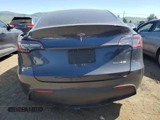 2022 Tesla Model Y Long Range with VIN 7SAYGDEE2NF402320, listed as a Copart auction lot 50396605 with 27,426 mi miles and Salvage Title. Bid and sale history available at DreamBid. Image 6.