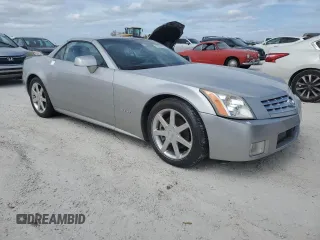 2004 Cadillac XLR z VIN 1G6YV34A945601007, wystawiony jako Copart lot #77077394 z przebiegiem Nie podano mil oraz Szkody całkowita. Historia ofert i sprzedaży dostępna na DreamBid. Obrazek 4.