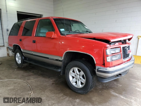 1999 GMC Yukon with VIN 1GKEK13R1XJ711537, listed as a Copart auction lot 51658175 with 228,786 mi miles and Salvage Title. Bid and sale history available at carsss.com. Image 4.
