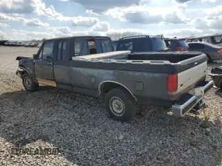 1989 Ford F-150 with VIN 1FTEX15N0KKB51052, listed as a Copart auction lot 70142074 with 74,351 mi miles and Salvage Title. Bid and sale history available at carsss.com. Image 2.