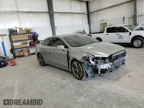 2020 Ford Fusion Titanium с VIN 3FA6P0K90LR112034, выставлен на аукционе Copart как лот 56740025 с пробегом 89 117 миль миль и Списание • Salvage title. История ставок и продаж доступна на DreamBid. Изображение 13.