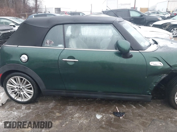 2017 MINI Convertible Cooper S z VIN WMWWG9C38H3C81071, wystawiony jako IAAI lot #41522738 z przebiegiem 59 040 mil mil oraz . Historia ofert i sprzedaży dostępna na DreamBid. Obrazek 13.
