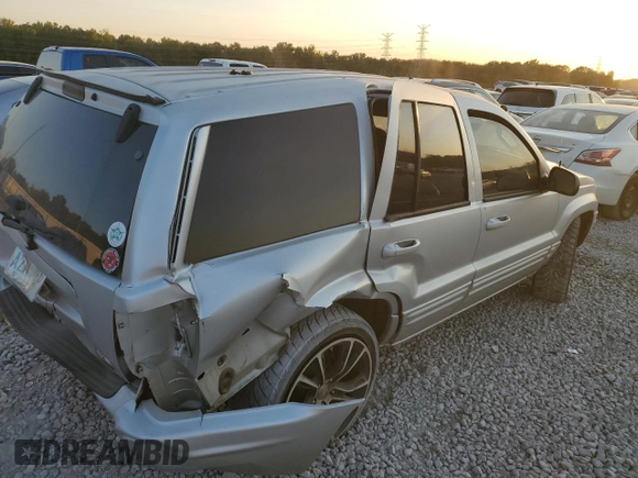 2004 Jeep Grand Cherokee with VIN 1J8GX58J54C284761, listed as a Copart auction lot 75614854 with 182,188 mi miles and Salvage title. Bid and sale history available at DreamBid. Image 3.