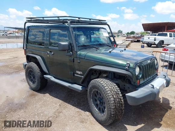 2012 Jeep Wrangler Sahara z VIN 1C4AJWBGXCL100527, wystawiony jako IAAI lot #42394623 z przebiegiem 126 097 mil mil oraz . Historia ofert i sprzedaży dostępna na DreamBid. Obrazek 1.