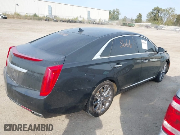 2013 Cadillac XTS Luxury with VIN 2G61P5S3XD9228218, listed as a IAAI auction lot 40503666 with 87,857 mi miles. Bid and sale history available at carsss.com. Image 4.