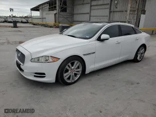 2014 Jaguar XJ with VIN SAJWJ2GD6E8V65987, listed as a Copart auction lot 50091105 with 136,080 mi miles and Clean Title. Bid and sale history available at carsss.com. Image 1.
