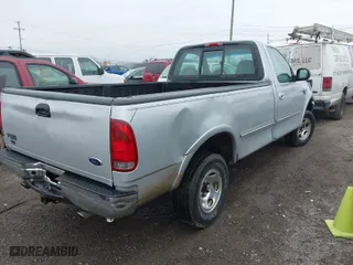 1998 Ford F-150 Standard with VIN 1FTZF18W2WNC27724, listed as a IAAI auction lot 41501654 with 336,342 mi miles. Bid and sale history available at carsss.com. Image 4.