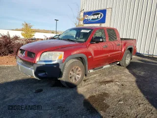 2006 Mitsubishi Raider Duro Cross z VIN 1Z7HT38N66S538442, wystawiony jako Copart lot #77142384 z przebiegiem 164 741 mil mil oraz Czysty tytuł • Clean title. Historia ofert i sprzedaży dostępna na DreamBid. Obrazek 1.