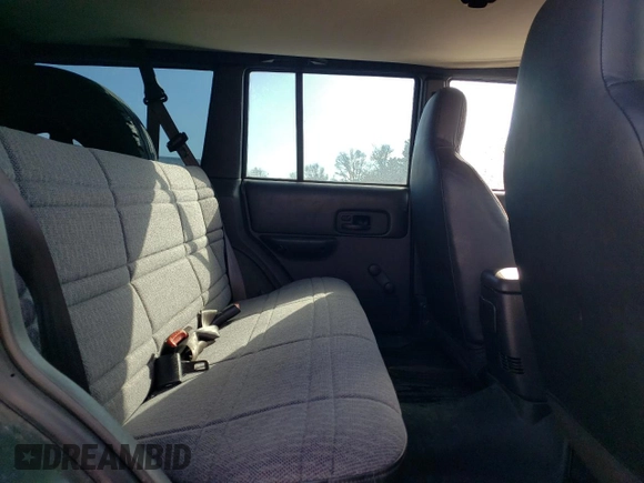 1999 Jeep Cherokee SE with VIN 1J4FF28S3XL551875, listed as a Copart auction lot 43057555 with 226,794 mi miles and Salvage title. Bid and sale history available at DreamBid. Image 11.