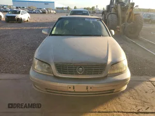 2000 Cadillac Catera z VIN W06VR54R5YR010954, wystawiony jako Copart lot #84863204 z przebiegiem 47 864 mil mil oraz Tytuł czysty. Historia ofert i sprzedaży dostępna na DreamBid. Obrazek 5.