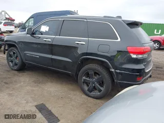 2014 Jeep Grand Cherokee Overland with VIN 1C4RJFCG6EC121654, listed as a IAAI auction lot 42051730 with 163,853 mi miles. Bid and sale history available at carsss.com. Image 3.