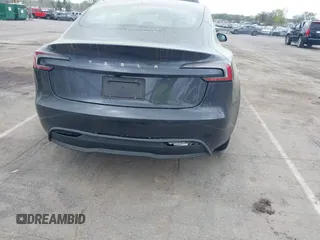 2025 Tesla Model 3 Long Range with VIN 5YJ3E1EA5SF890621, listed as a IAAI auction lot 41924915 with 6,528 mi miles and . Bid and sale history available at DreamBid. Image 6.