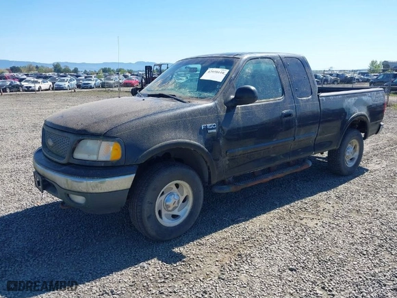 2000 Ford F-150 XL with VIN 1FTRX18L6YKB06492, listed as a IAAI auction lot 42058110 with 169,217 mi miles. Bid and sale history available at carsss.com. Image 2.