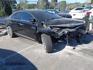 2016 Cadillac XTS Luxury Collection with VIN 2G61M5S3XG9156479, listed as a IAAI auction lot 41331374 with 129,246 mi miles. Bid and sale history available at carsss.com. Image 1.