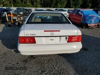 1997 Mercedes-Benz SL 500 with VIN WDBFA67FXVF149930, listed as a Copart auction lot 64749525 with 88,523 mi miles and Salvage title. Bid and sale history available at DreamBid. Image 6.