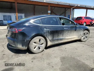 2019 Tesla Model 3 Long Range with VIN 5YJ3E1EB8KF451535, listed as a Copart auction lot 53085105 with 133,928 mi miles and Non Repairable. Bid and sale history available at DreamBid. Image 3.