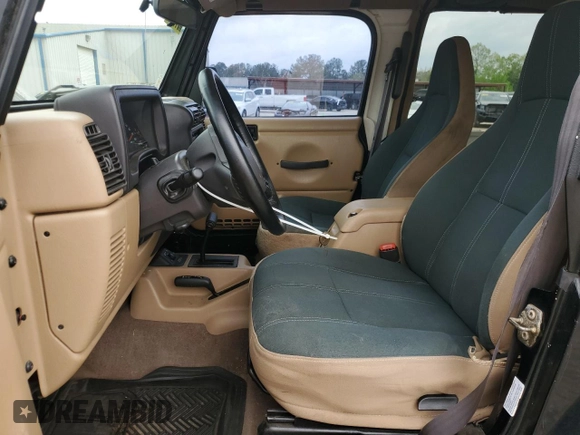 2002 Jeep Wrangler Sahara with VIN 1J4FA59S22P771136, listed as a Copart auction lot 51528665 with 236,882 mi miles and Salvage title. Bid and sale history available at DreamBid. Image 7.