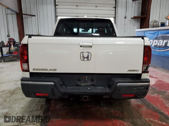 2017 Honda Ridgeline RTL-E with VIN 5FPYK3F72HB002890, listed as a Copart auction lot 57699735 with 128,813 mi miles and Salvage title. Bid and sale history available at DreamBid. Image 6.